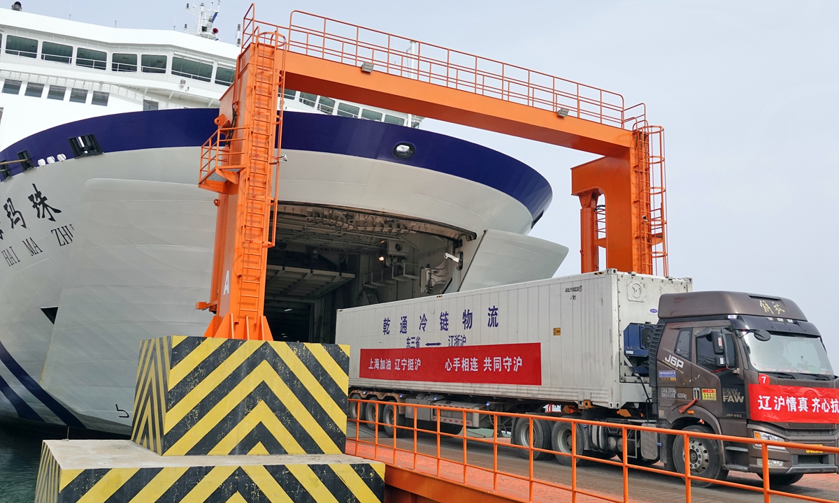 A container truck drives out of a passenger ship at the Yantai port in Yantai, East China's Shandong Province, on April 13, 2022. The truck is full of supplies to aid Shanghai in its fight against the virus. Photo: VCG