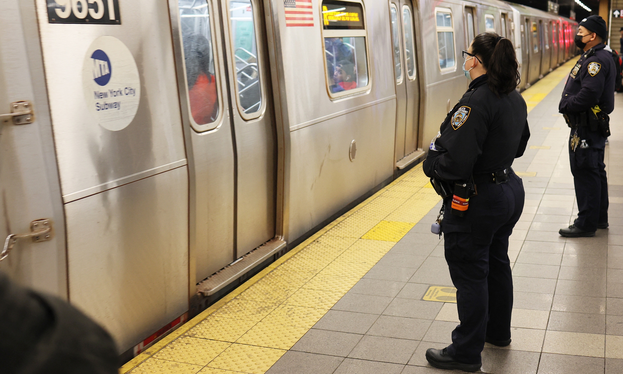 NYPD officers patrol the subway platform at the 36th Street subway station on April 13, 2022 in the Sunset Park neighborhood of Brooklyn, New York City. A manhunt is under way for a gunman who critically injured more than 20 on the train during Tuesday's morning rush hour. Photo: AFP