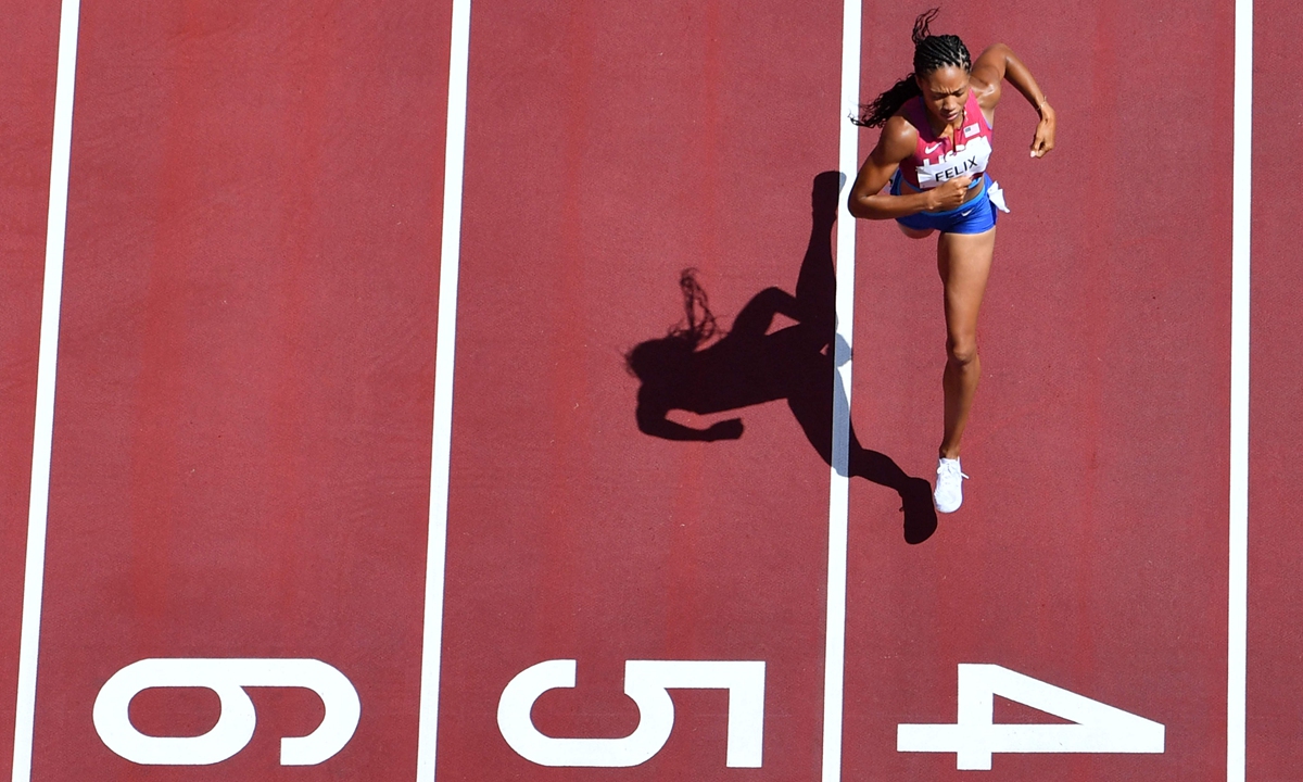 Allyson Felix runs in the women's 400 meters heats during the Tokyo Olympic Games on August 3, 2021 in Tokyo, Japan. Photo: VCG