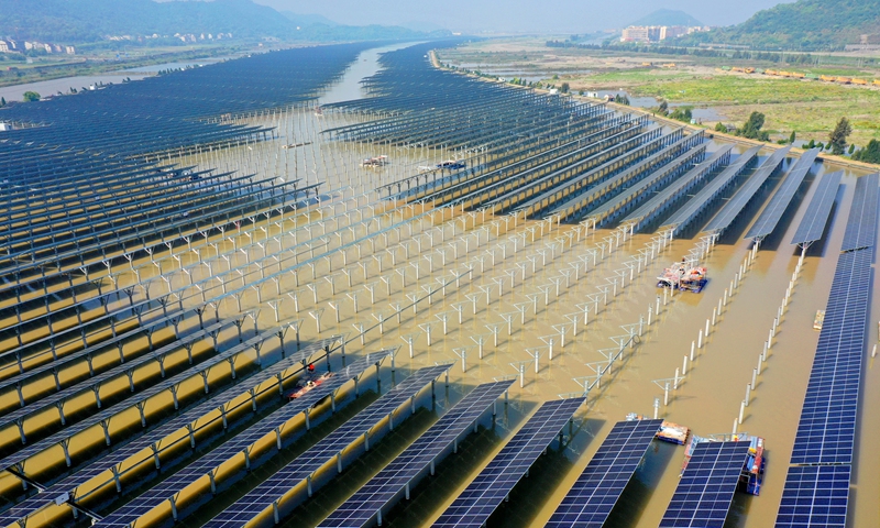Workers install the final solar panels at the Jiangxia Tidal Power Station in Wenling, East China's Zhejiang Province, on April 21, 2022. The station is China's first power plant to use tidal and solar power simultaneously, and the fourth in the world. The 2,000-mu (133 hectares) project will have an installed capacity of 100 megawatts. Photo: VCG