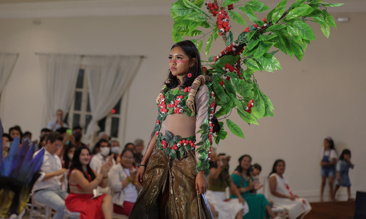 An Indigenous model presents a creation during a fashion event in Manaus, Amazonas state, Brazil, on April 9, 2022.Photo: AFP