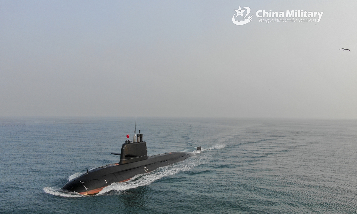 A submarine attached to a submarine flotilla with the navy under the PLA Northern Theater Command bears off a port for the maritime combat training drills on March 23, 2022. Photo:China Military
