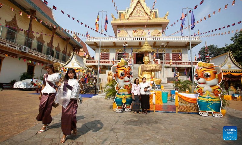 People visit the Ounalom pagoda in Phnom Penh, Cambodia, April 14, 2022. Cambodia on Thursday began to celebrate the traditional New Year festival after muted celebrations in the last two years due to the COVID-19 pandemic.Photo:Xinhua
