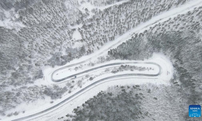 Aerial photo taken on April 14, 2022 shows a view of the snow-covered Saihanba National Forest Park in Chengde City, north China's Hebei Province.(Photo: Xinhua)