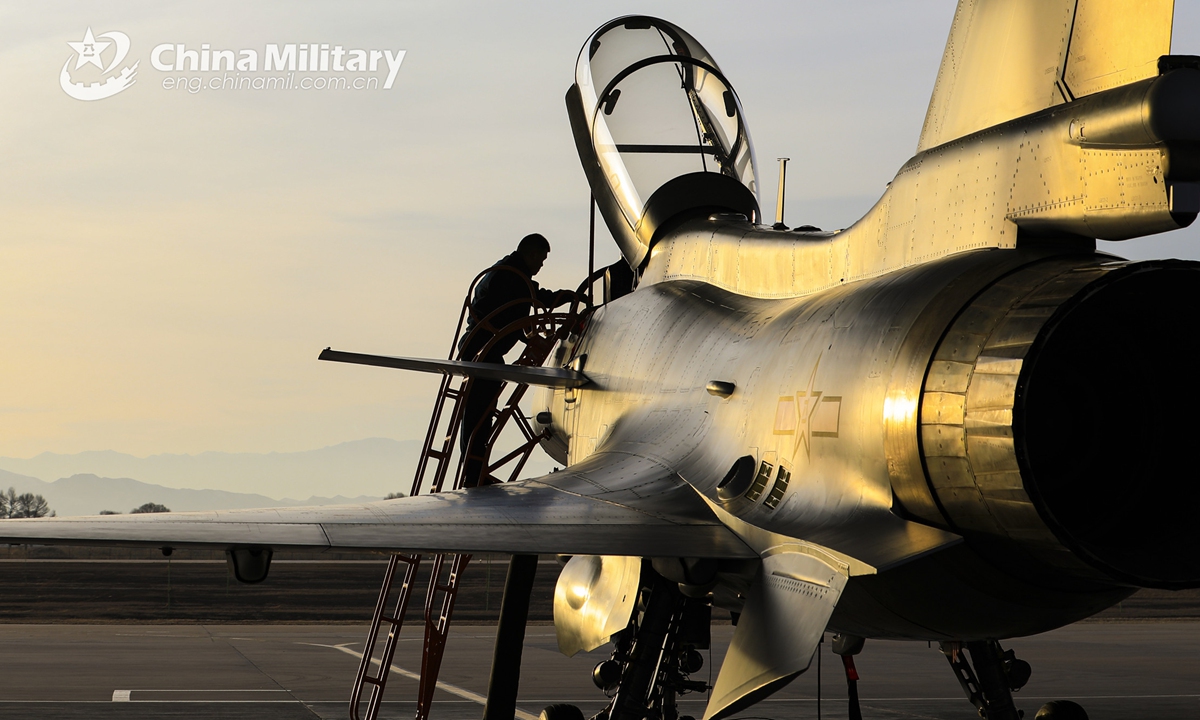 A ground crew member assigned to an aviation brigade under the PLA Central Theater Command checks and maintains a J-10 fighter jet during a daytime flight training exercise which aims to hone the skills of pilots on March 19, 2022.Photo:China Military
