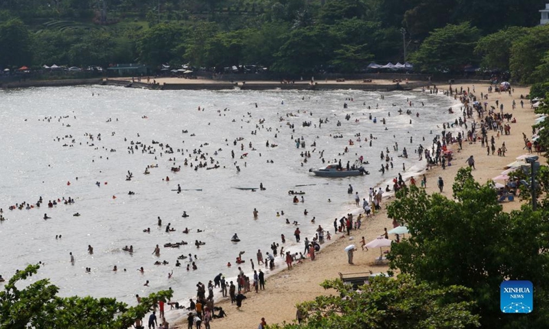 People enjoy the traditional New Year holiday at a seaside resort in Kep province, southwestern Cambodia on April 15, 2022. Cambodia on Thursday began to celebrate the three-day traditional New Year festival after muted celebrations in the last two years due to the COVID-19 pandemic. (Photo by Sovannara/Xinhua)