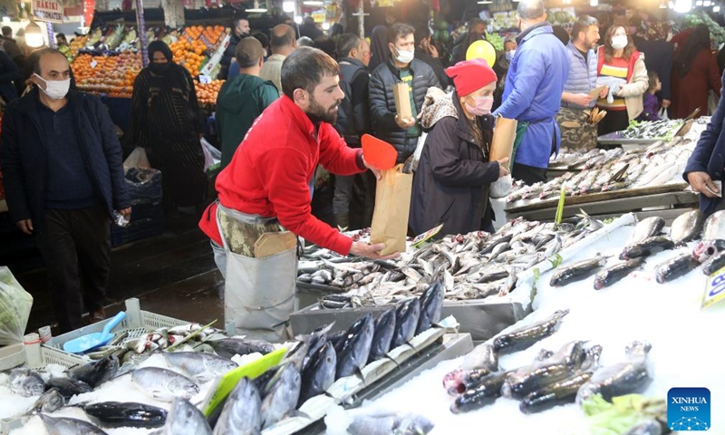A fishmonger works at a market in Ankara, Turkey, on April 16, 2022.Photo:Xinhua