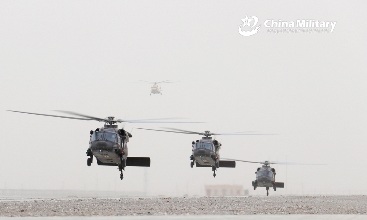 Multiple types of helicopters attached to an army aviation brigade under the PLA 76th Group Army conduct hover checks during a flight training exercise on March 17, 2022. (eng.chinamil.com.cn/Photo by Wu Xiaofeng)