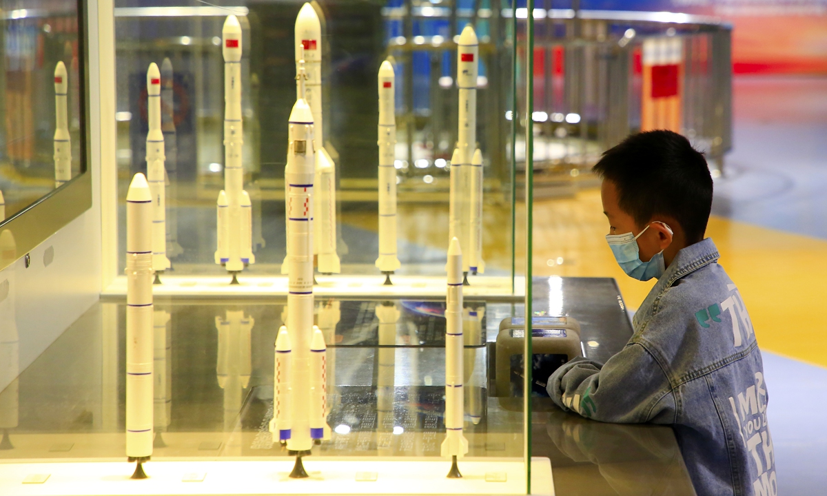 A boy views a model of the Shenzhou spaceship at an aerospace science popularization exhibition at the Ningxia Science and Technology Museum in Yinchuan, Northwest China's Ningxia Hui Autonomous Region on April 17, 2022. Photo: VCG