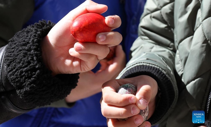 Children tap eggs during the Easter egg tapping event in Vodice, Croatia, April 17, 2022.Photo:Xinhua
