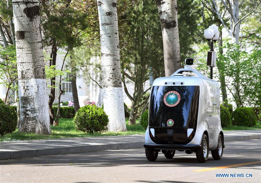 A 5G unmanned delivery car delivers goods at the Beijing Institute of Technology in Beijing, capital of China, April 6, 2020. Photo: Xinhua/Ren Chao 
