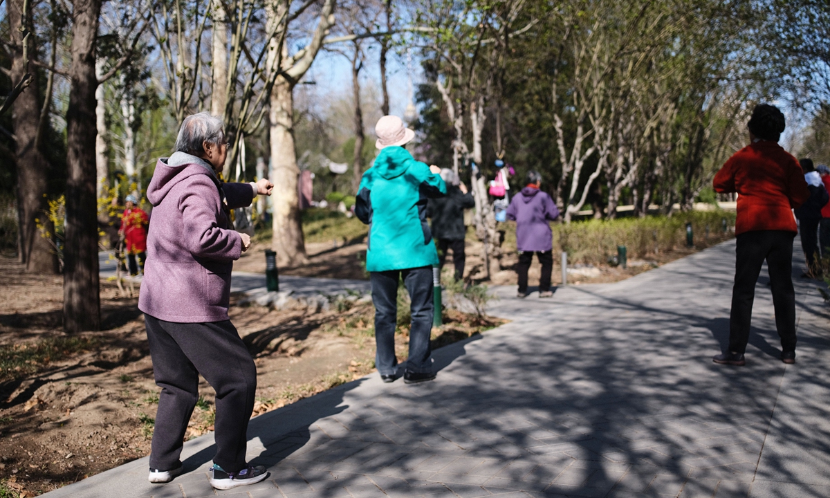 Old people exercise at Yuyuantan Park in Beijing on April 18, 2021. Photo: IC photo.