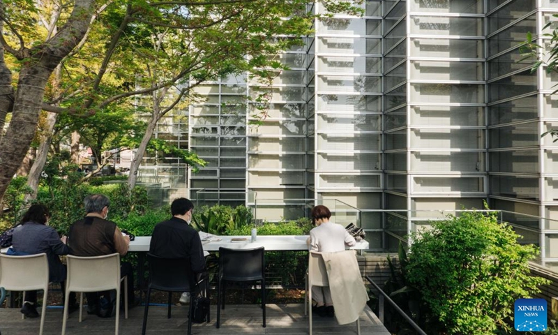 People read books in a park of the Suginami City Central Library in Tokyo, Japan, April 10, 2022. (Photo: Xinhua)