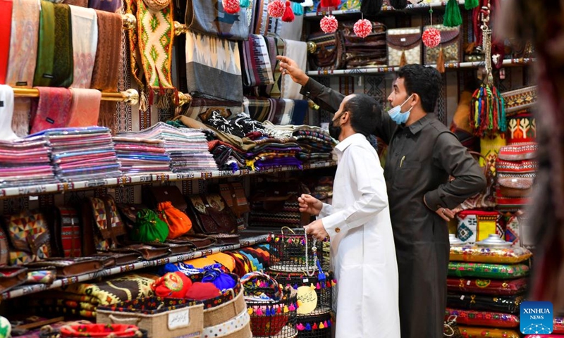 People buy traditional items at a shop in preparation for the Eid al-Fitr festival in Doha, Qatar, April 19, 2022.(Photo: Xinhua)