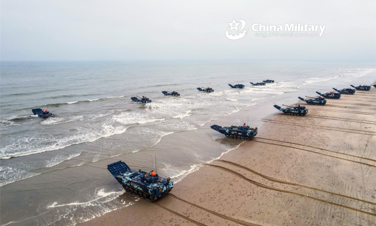 Amphibious armored vehicles attached to a brigade under the PLA Marine Corps head to the designed training waters during a maritime training exercise on March 13, 2022. (eng.chinamil.com.cn/Photo by Li Weike)