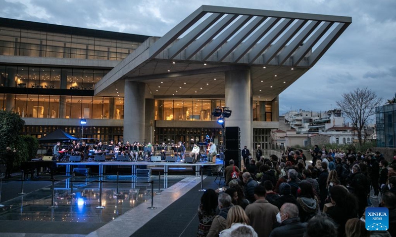Musicians perform in front of the Acropolis Museum during the first Sacred Music Festival in Athens, Greece, on April 19, 2022. The first Sacred Music Festival takes place at 17 landmarks in Athens from April 18 to April 20.(Photo: Xinhua)