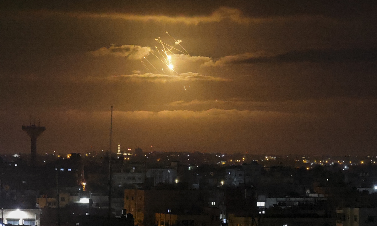 A missile from Israel's Iron Dome air defense system, designed to intercept and destroy incoming short-range rockets and artillery shells, lights the sky in the central Gaza Strip on April 21, 2022. Israeli jets struck Gaza in the early hours of April 21, 2022, witnesses and security sources said, hours after militants in the Palestinian enclave fired a rocket into the Jewish state. Photo: AFP