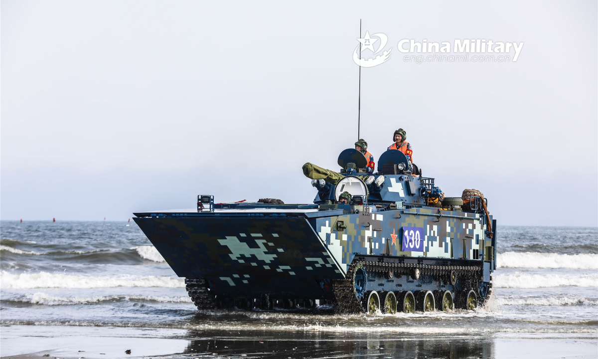 An amphibious infantry fighting vehicle attached to a brigade under the PLA Marine Corps makes its way to the beach-head during a maritime training exercise on March 13, 2022. (eng.chinamil.com.cn/Photo by Su Zhihuang)