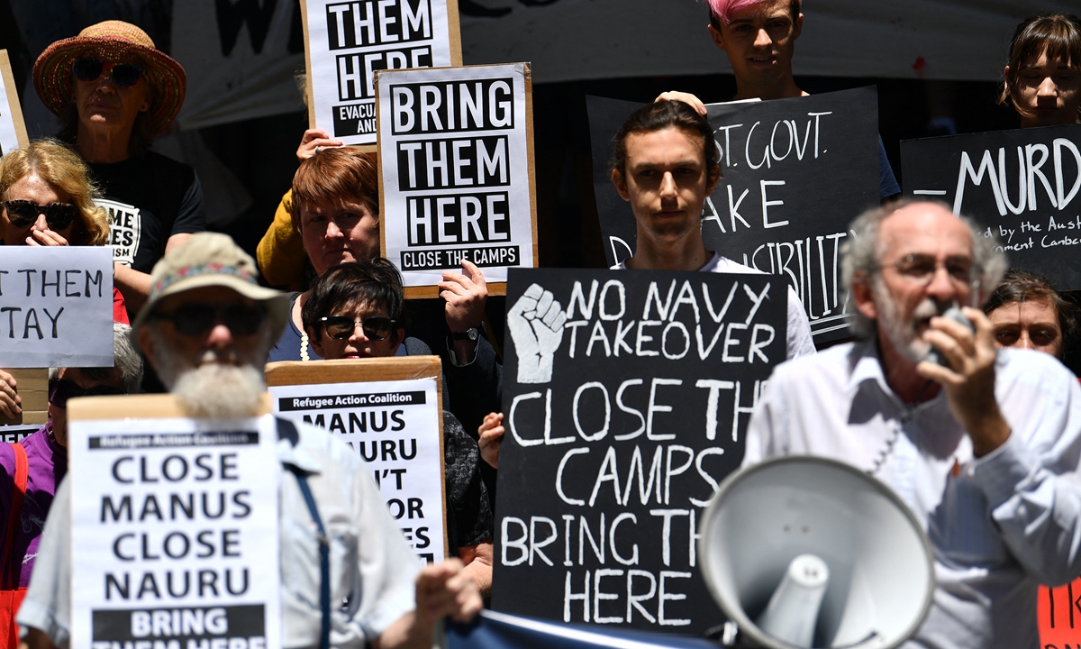 Refugee advocates protest against the closing of asylum seeker camps in Papua New Guinea, in front of the Sydney Commonwealth government offices on October 31, 2017. Photo: AFP