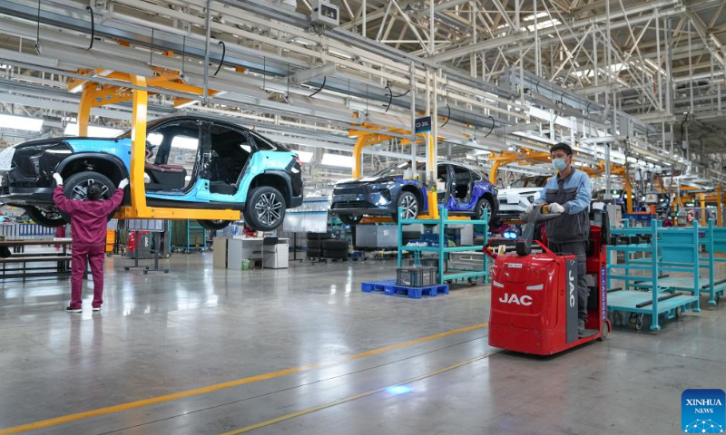 Technicians work on a vehicle production line at the NIO manufacturing base in Hefei, east China's Anhui Province, April 21, 2022. The NIO manufacturing base in Hefei is gradually resuming production. (Xinhua/Du Yu)