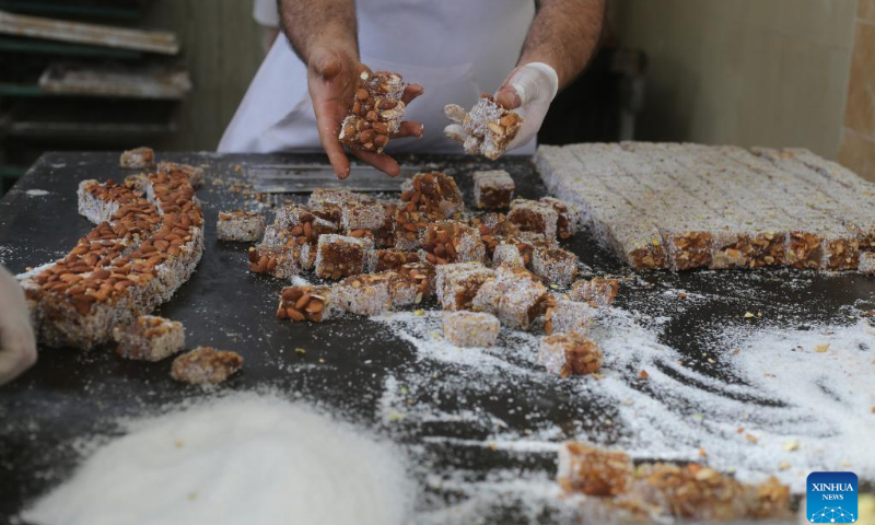 A worker makes Turkish delight sweets or 