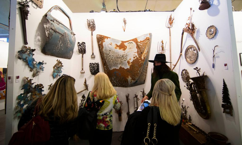 People visit the 2022 Artist Project in Toronto, Canada, on April 21, 2022. Showcasing original artworks by over 200 contemporary artists across Canada, this annual art fair is held from April 21 to 24 this year. (Photo: Xinhua)