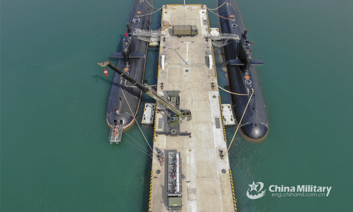 Sailors load missiles onto the submarines on March 22, 2022. Submarines attached to a navy flotilla under the PLA Northern Theatre Command had their ammunitions refreshed on March 22. Photo:China Military