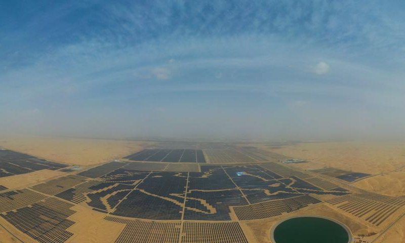 Aerial panoramic photo taken on April 21, 2022 shows the Dalad Photovoltaic Power Base in Dalad Banner, north China's Inner Mongolia Autonomous Region. Dalad Photovoltaic Power Base, composed of nearly 200,000 photovoltaic panels, promotes ecological management of the desert while utilizing rich solar energy resources in Kubuqi Desert. (Photo: Xinhua)