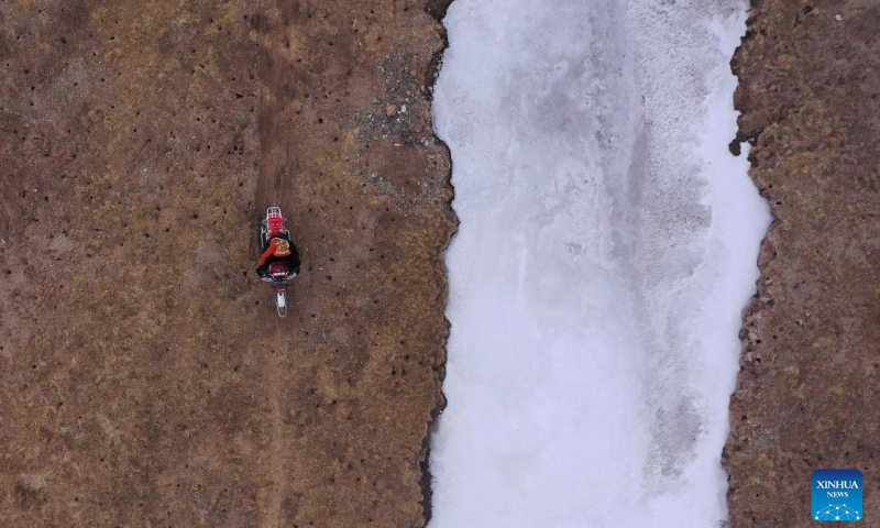 Aerial photo taken on April 21, 2022 shows a ranger patroling around Yoigilangleb Qu (river) in Qumalai County of Yushu Tibetan Autonomous Prefecture in northwest China's Qinghai Province. Yoigilangleb Qu (river) is located at the core area of Sanjiangyuan National Park. Sanjiangyuan, meaning the 