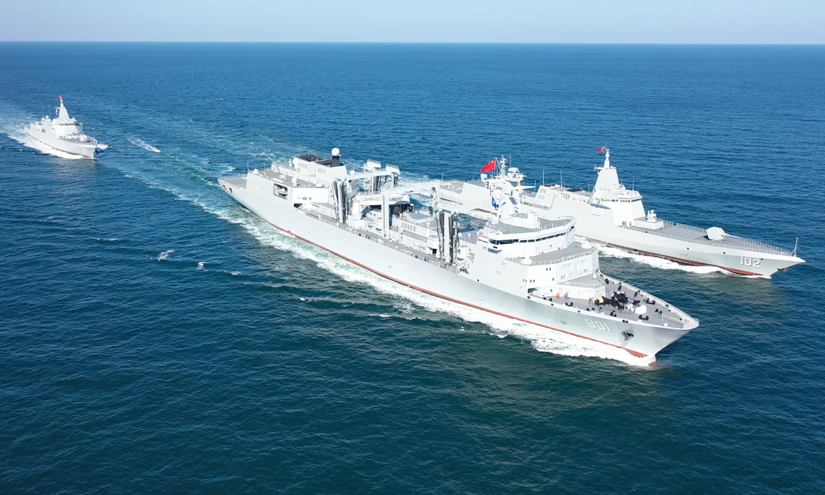 The Type 901 comprehensive supply ship Hulunhu conducts maritime replenishment to the Type 055 destroyers <em>Lhasa</em> and Anshan at an undisclosed sea region in 2022. Photo: Courtesy of the PLA Navy