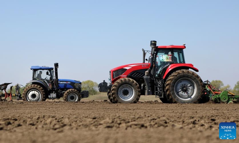 A tractor ploughs at a soybean farm in Shisijiazi Village of Daniu Township in Tai'an County, northeast China's Liaoning Province, April 22, 2022.Photo:Xinhua