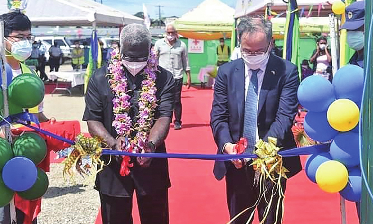 China's ambassador to the Solomon Islands Li Ming (right), and Solomons Prime Pinister Manasseh Sogavare (left) lead the ribbon-cutting ceremony of a China-funded national stadium complex in Honiara on April 22. The stadium complex, reportedly worth $53 million, will host the 2023 Pacific Games for the first time in the island state of 800,000 people. Photo: AFP