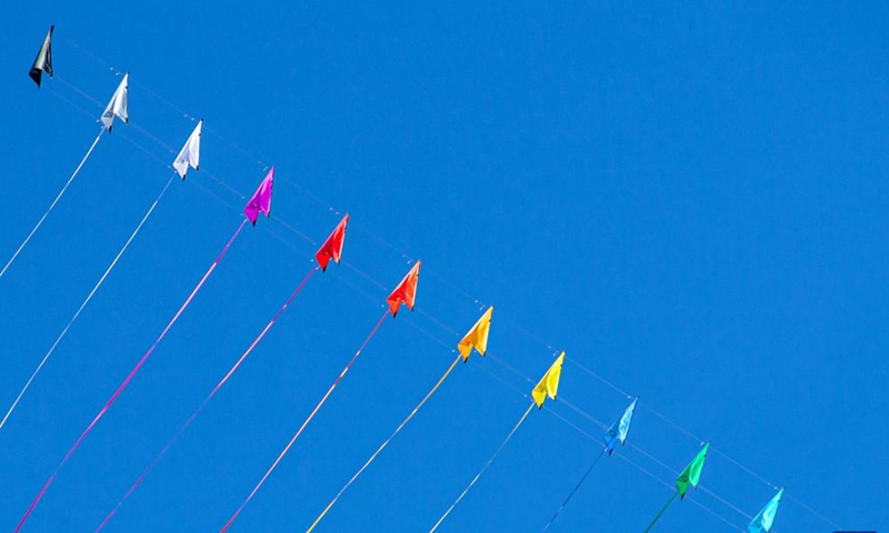 Kites hover above the Cha-am Beach in Phetchaburi, Thailand, on April 23, 2022.Photo:Xinhua