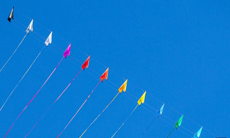 Kites hover above the Cha-am Beach in Phetchaburi, Thailand, on April 23, 2022.Photo:Xinhua