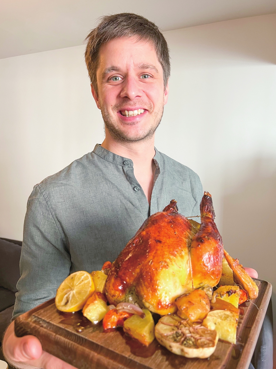Chef Corentin Delcroix shows off a roasted chicken made during quarantine. Photo: Courtesy of Delcroix