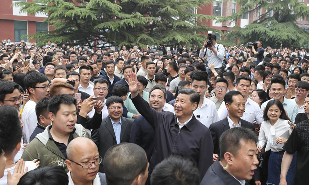 President Xi Jinping waves to faculty members and students while inspecting China University of Political Science and Law in Beijing on May 3, 2017. Photo: Xinhua