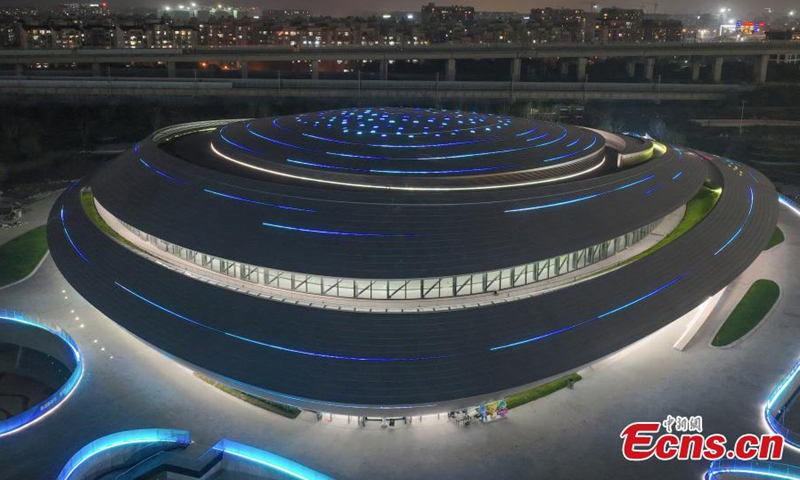 Aerial photo shows night view of China Hangzhou Esports Center, a venue of the 19th Asian Games Hangzhou 2022 in Hangzhou, east China's Zhejiang Province, April 24, 2022. The 19th Asian Games will be held in Hangzhou from September 10 to 25. (Photo: China News Service/Wang Gang)