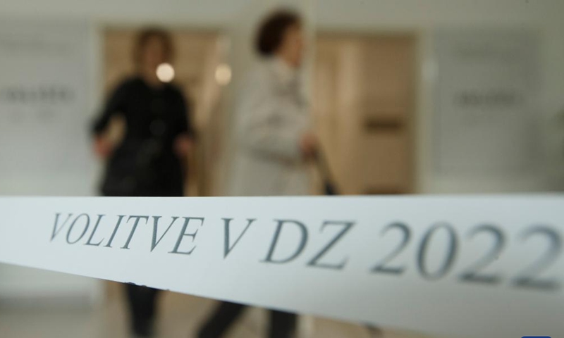 Photo taken on April 24, 2022 shows 2022 parliamentary election sign at the entry of a polling station in Ljubljana, Slovenia.Photo:Xinhua