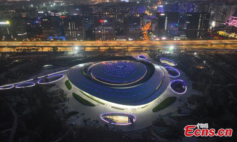 Aerial photo shows night view of China Hangzhou Esports Center, a venue of the 19th Asian Games Hangzhou 2022 in Hangzhou, east China's Zhejiang Province, April 24, 2022. The 19th Asian Games will be held in Hangzhou from September 10 to 25. (Photo: China News Service/Wang Gang)