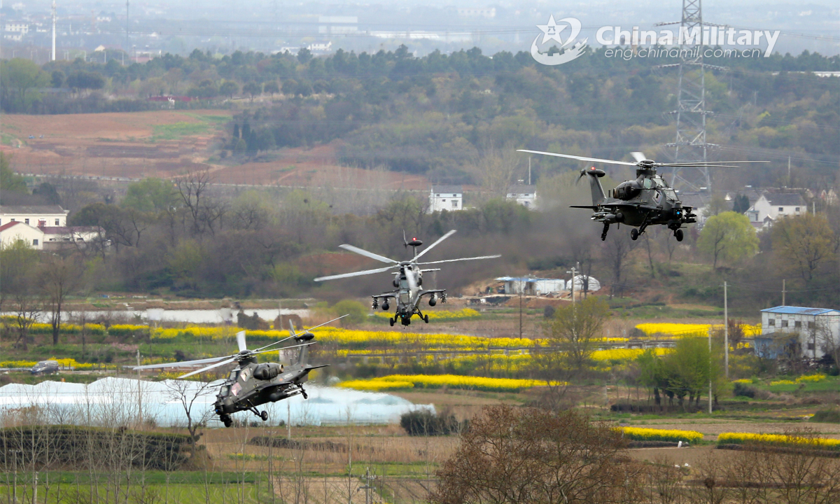 Helicopters attached to an army aviation brigade under the PLA 72nd Group Army conduct an ultralow-altitude penetration mission in the tactical flight training on March 22, 2022. Photo: China Military