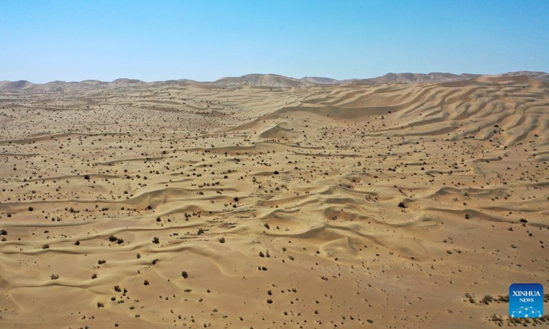 Aerial photo taken on April 18, 2022 shows the desert near the Mogao Grottoes in Dunhuang, northwest China's Gansu Province. Located in Dunhuang, northwest China's Gansu Province, the millennium-old Mogao Grottoes are home to a vast collection of Buddhist artworks which are considered the finest in existence -- more than 2,000 colored sculptures and 45,000 square meters of murals -- in 735 caves carved along a cliff by ancient worshippers.(Photo: Xinhua)