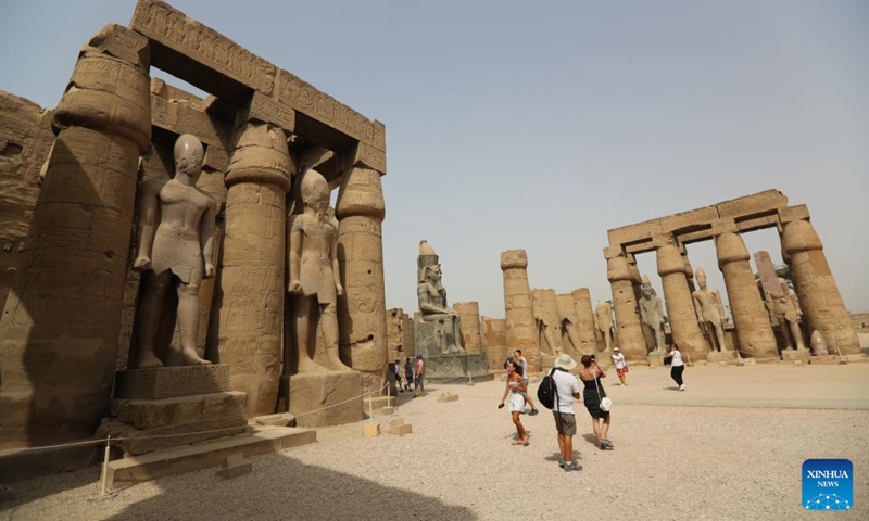 Tourists visit the Luxor Temple in Luxor, Egypt, on April 26, 2022. Luxor, a capital of ancient Upper Egypt known as Thebes, is nowadays a famous tourist destination for the historic temple buildings and other relics.(Photo: Xinhua)