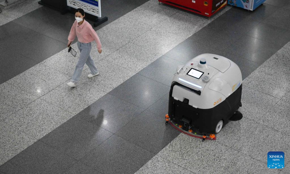An unmanned floor-cleaning device works in Hefei South Railway Station in Hefei, east China's Anhui Province, April 27, 2022.Photo:Xinhua
