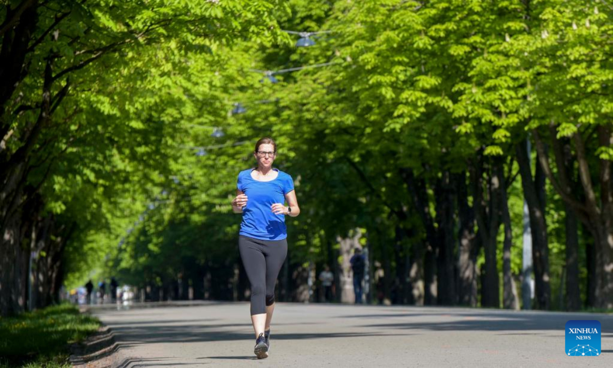 A jogger runs at Prater Hauptallee in Vienna, Austria on April 29, 2022. The famous Prater Hauptallee was awarded the World Athletics Heritage Plaque in the category of Landmark earlier this April.Photo:Xinhua