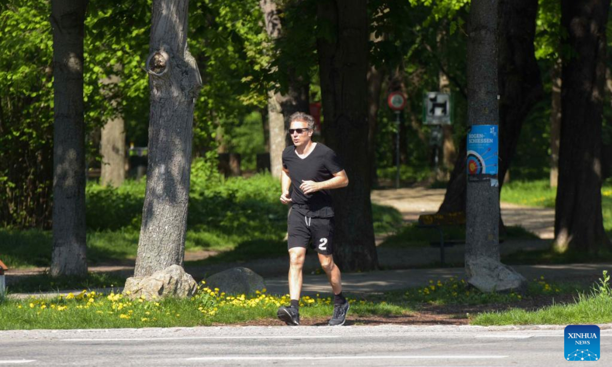 A jogger runs at Prater Hauptallee in Vienna, Austria on April 29, 2022. The famous Prater Hauptallee was awarded the World Athletics Heritage Plaque in the category of Landmark earlier this April.Photo:Xinhua