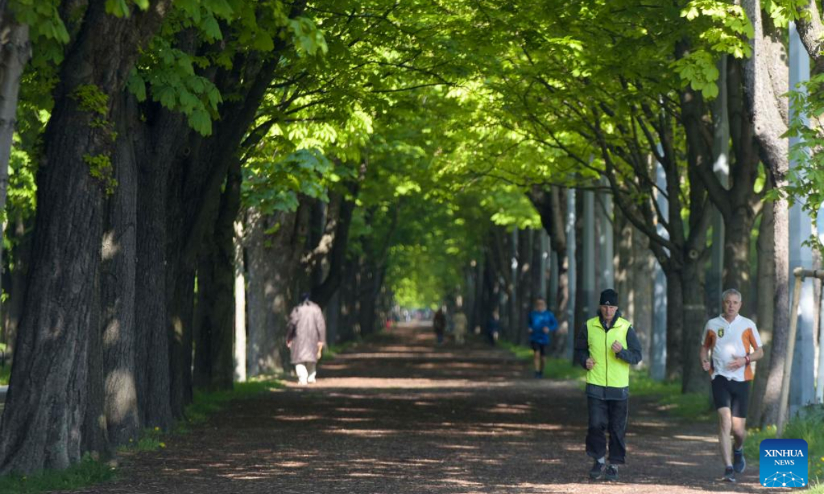 Joggers run at Prater Hauptallee in Vienna, Austria on April 29, 2022. The famous Prater Hauptallee was awarded the World Athletics Heritage Plaque in the category of Landmark earlier this April. Photo:Xinhua