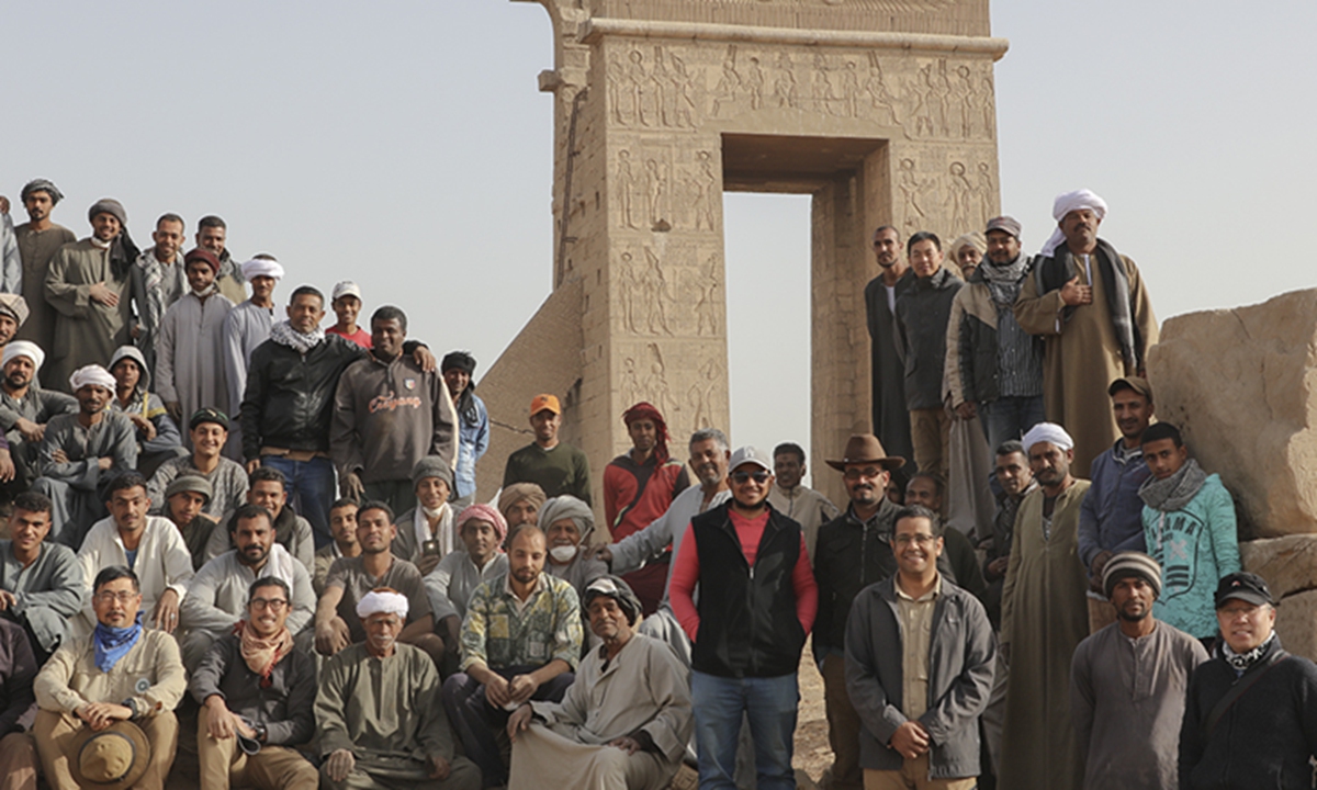 Chinese and Egyptian archaeologists pose for a picture at the Montu Temple site in Luxor, Egypt. Photo: Courtesy of Jia Xiaobing