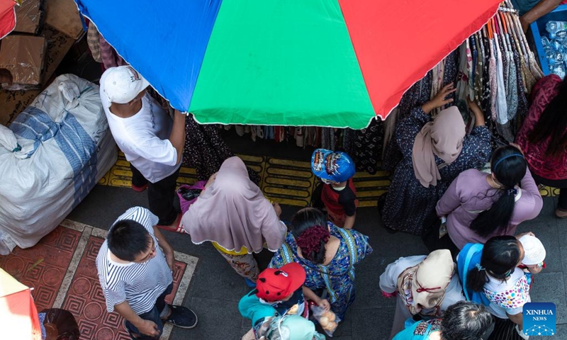People shop for new clothes ahead of Eid Al-Fitr at the Tanah Abang market, in Jakarta, Indonesia, on April 25, 2022.(Photo: Xinhua)