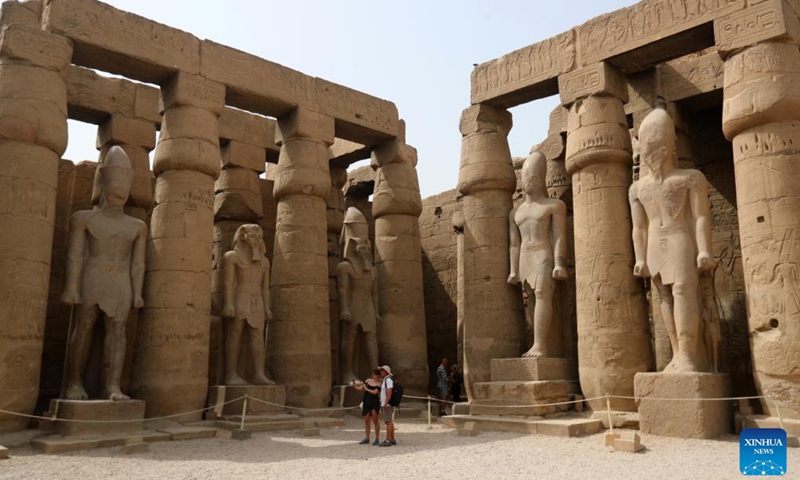 Tourists visit the Luxor Temple in Luxor, Egypt, on April 26, 2022. Luxor, a capital of ancient Upper Egypt known as Thebes, is nowadays a famous tourist destination for the historic temple buildings and other relics.(Photo: Xinhua)