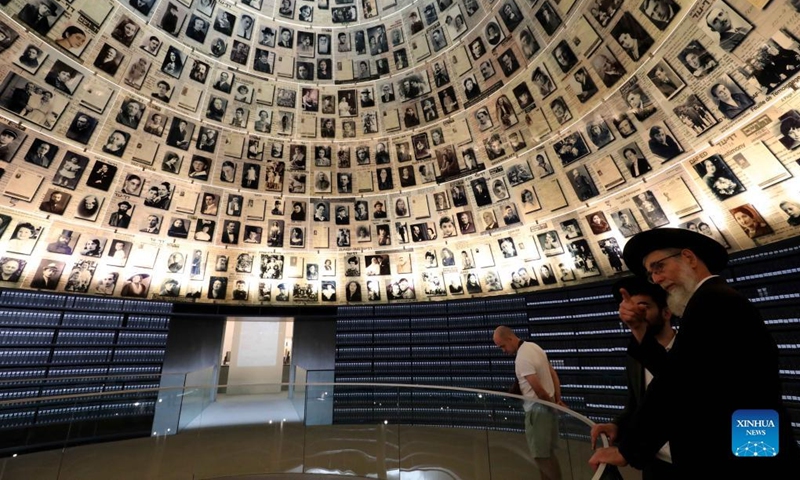 People visit Yad Vashem, the World Holocaust Remembrance Center, in Jerusalem on April 26, 2022. Israel's national annual Holocaust remembrance day will be marked on Wednesday and Thursday, in remembering the 6 million Jews who perished in the Holocaust during the Second World War. (Photo by Gil Cohen Magen/Xinhua)